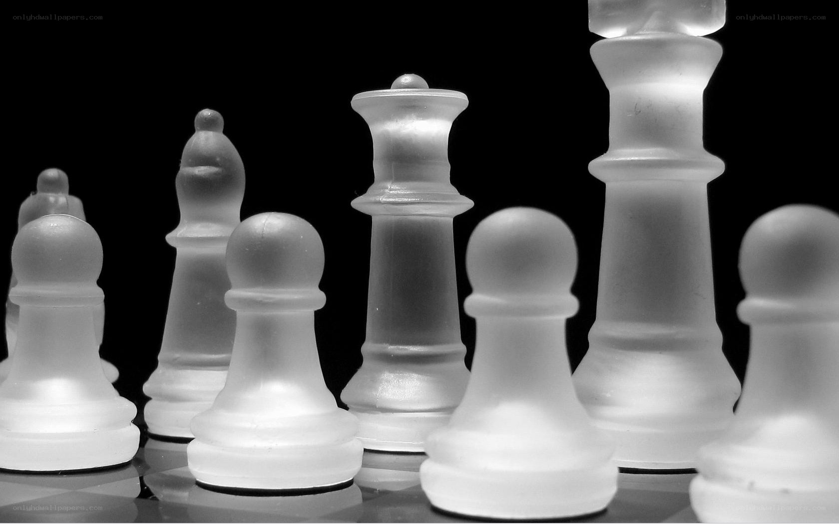 Frosted chess pieces on black