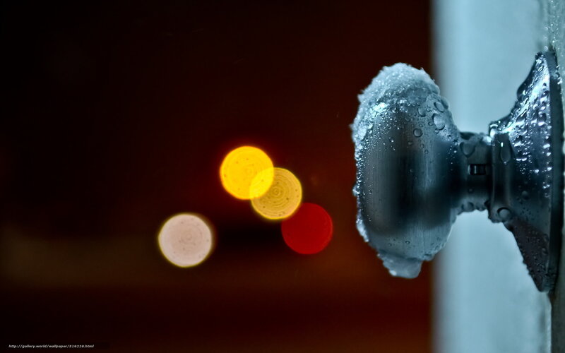 frosted doorknob with city lights
