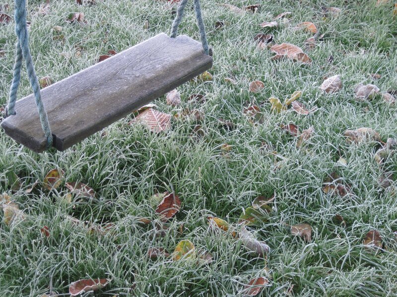 Frosted swing on a cold morning