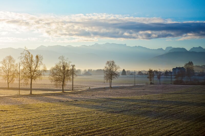 Frosty field with mountains