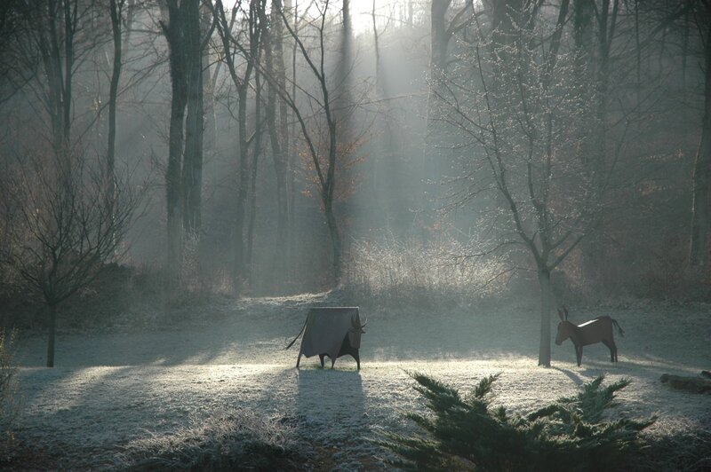 Frosty forest with sculptures