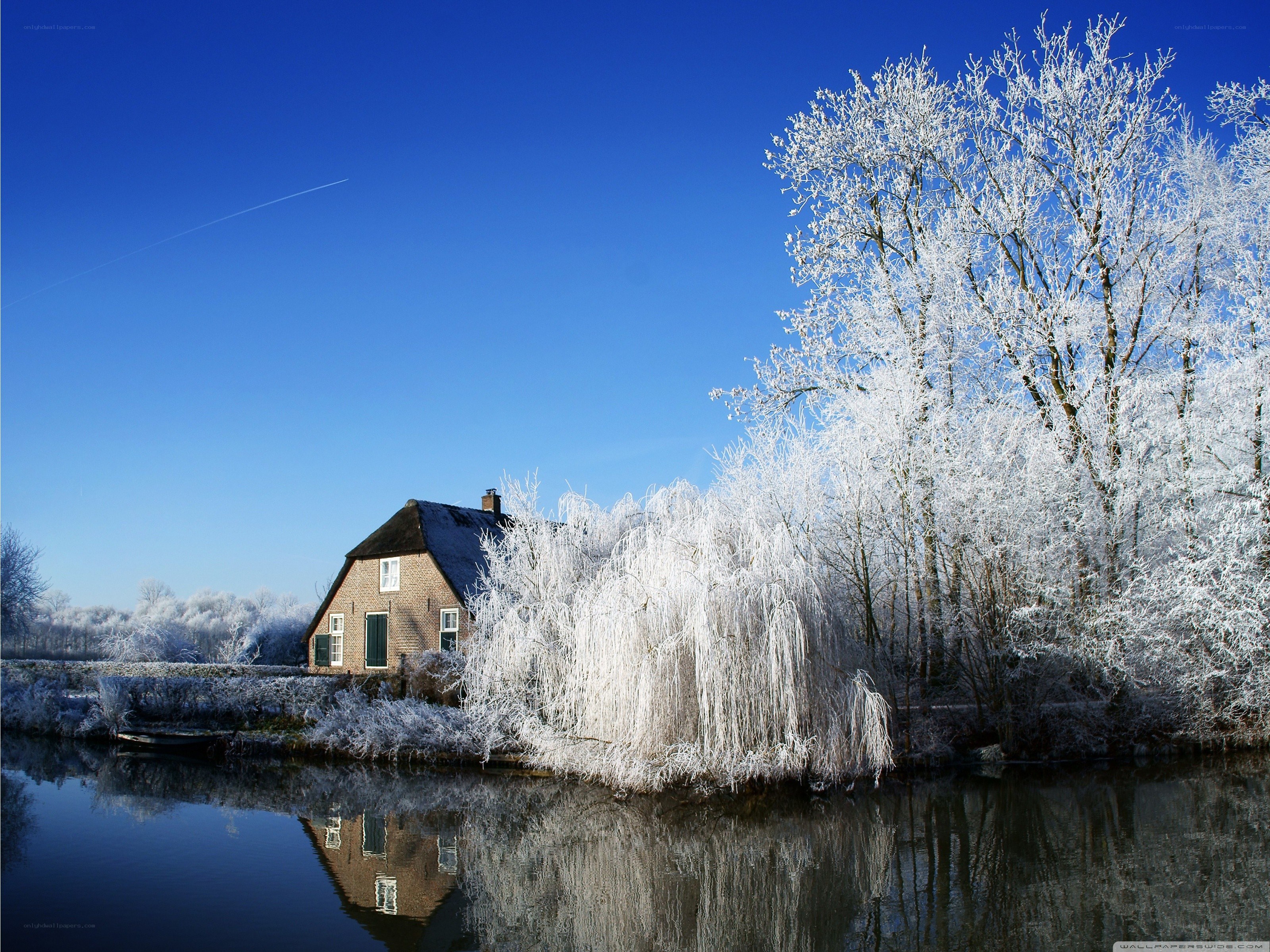 Frosty house by a canal