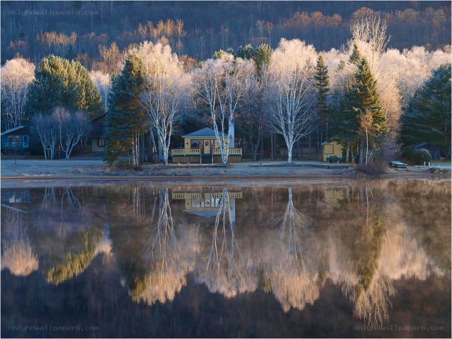 Frosty lake reflection at dawn