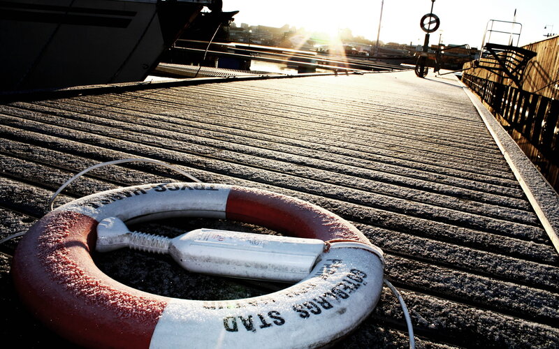 frosty lifebuoy on dock