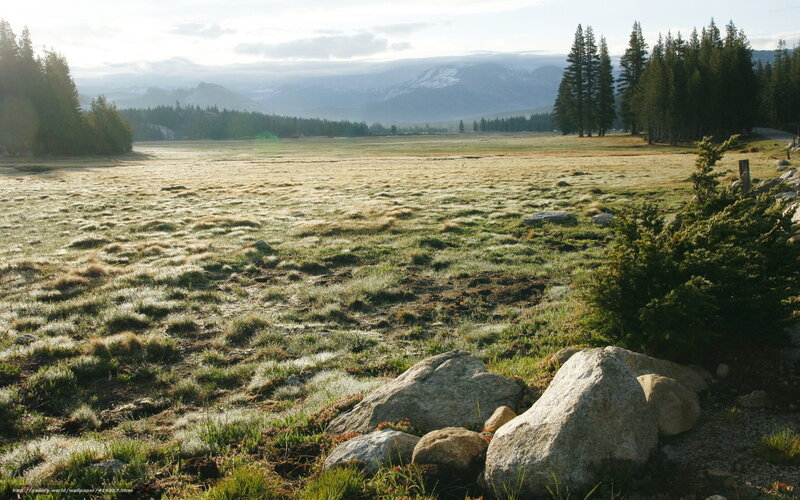 Frosty meadow with mountains