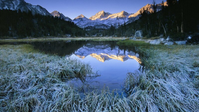 Frosty mountain lake at dawn