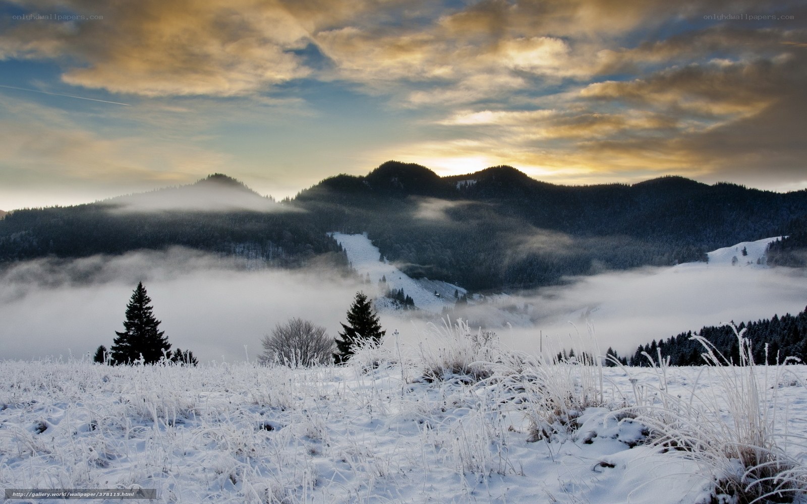 Frosty mountain valley at sunrise
