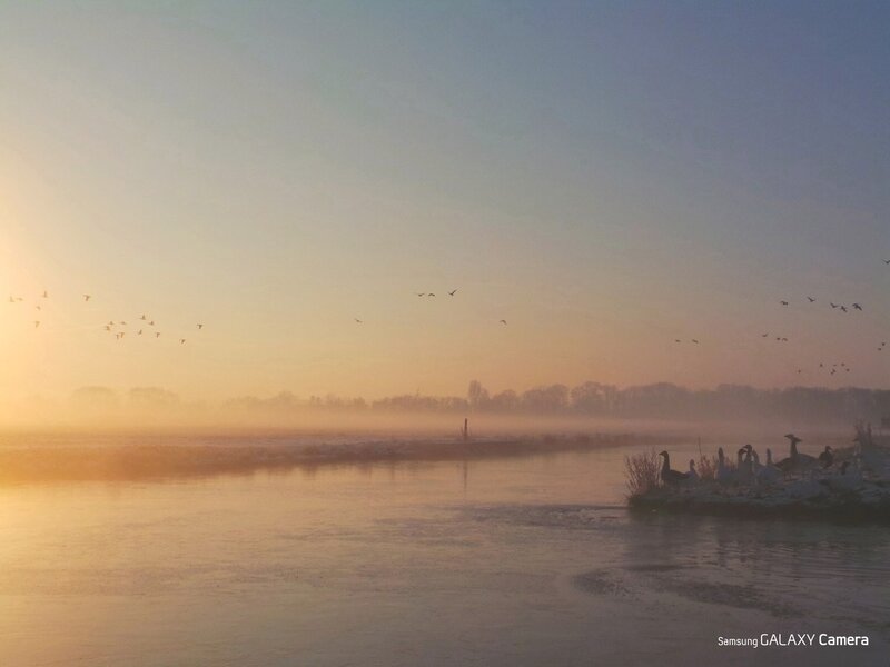 Frosty river at sunrise
