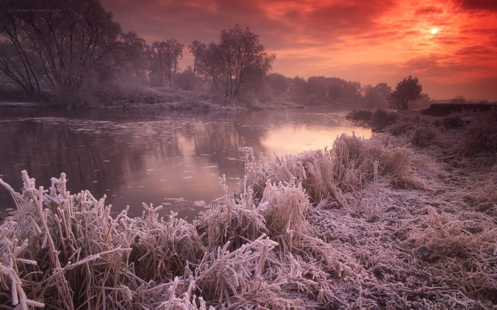 Frosty river at sunset