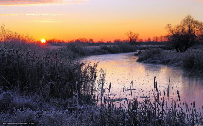 Frosty river at sunset
