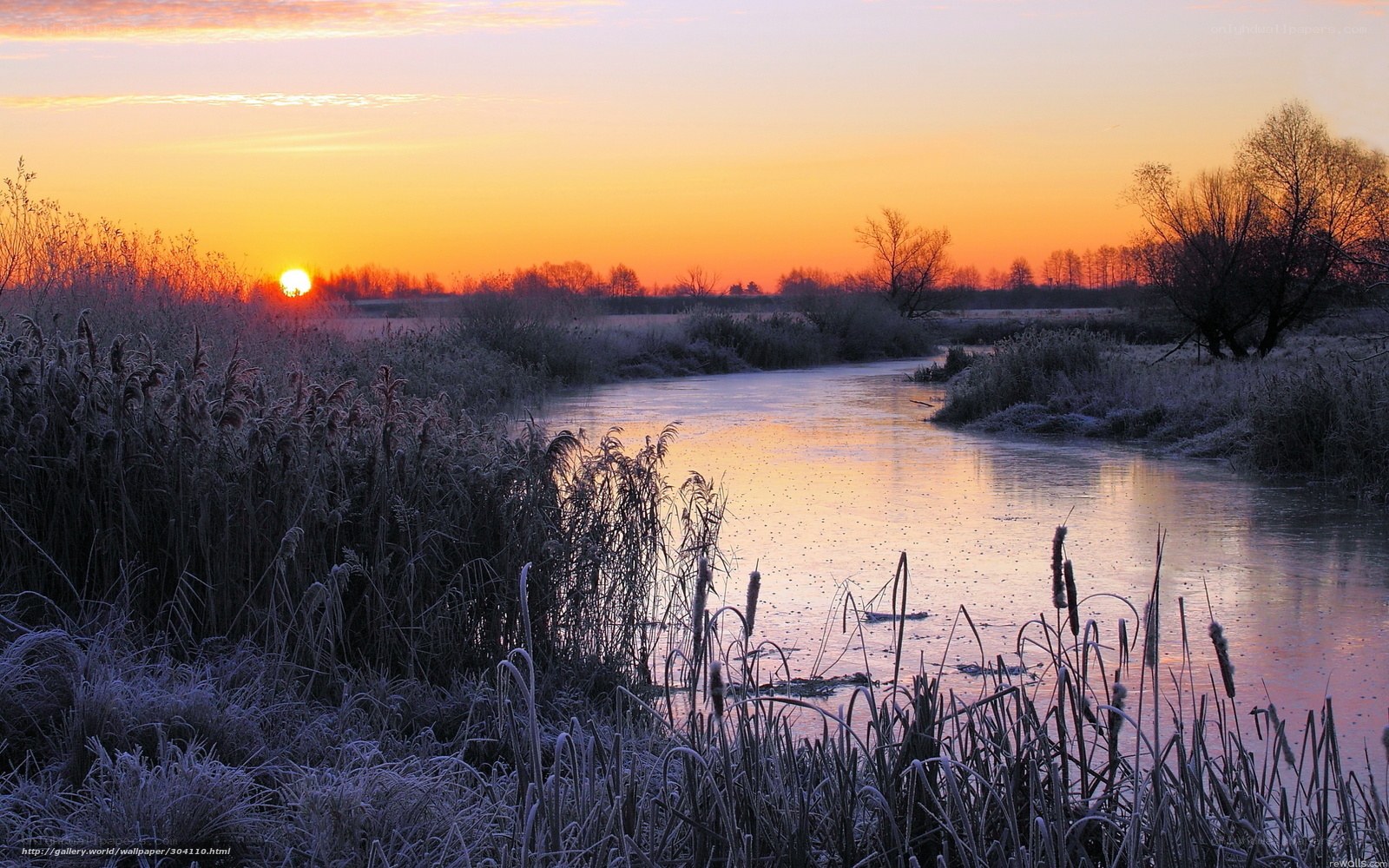 Frosty river at sunset