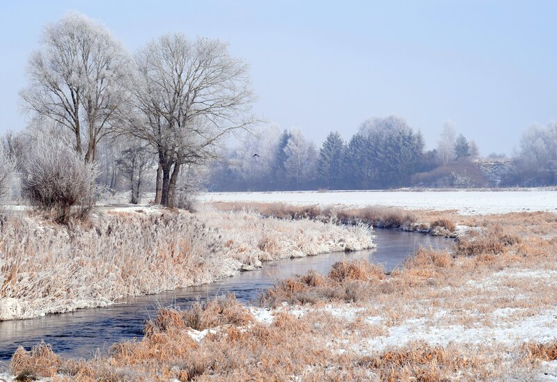 Frosty river in winter landscape