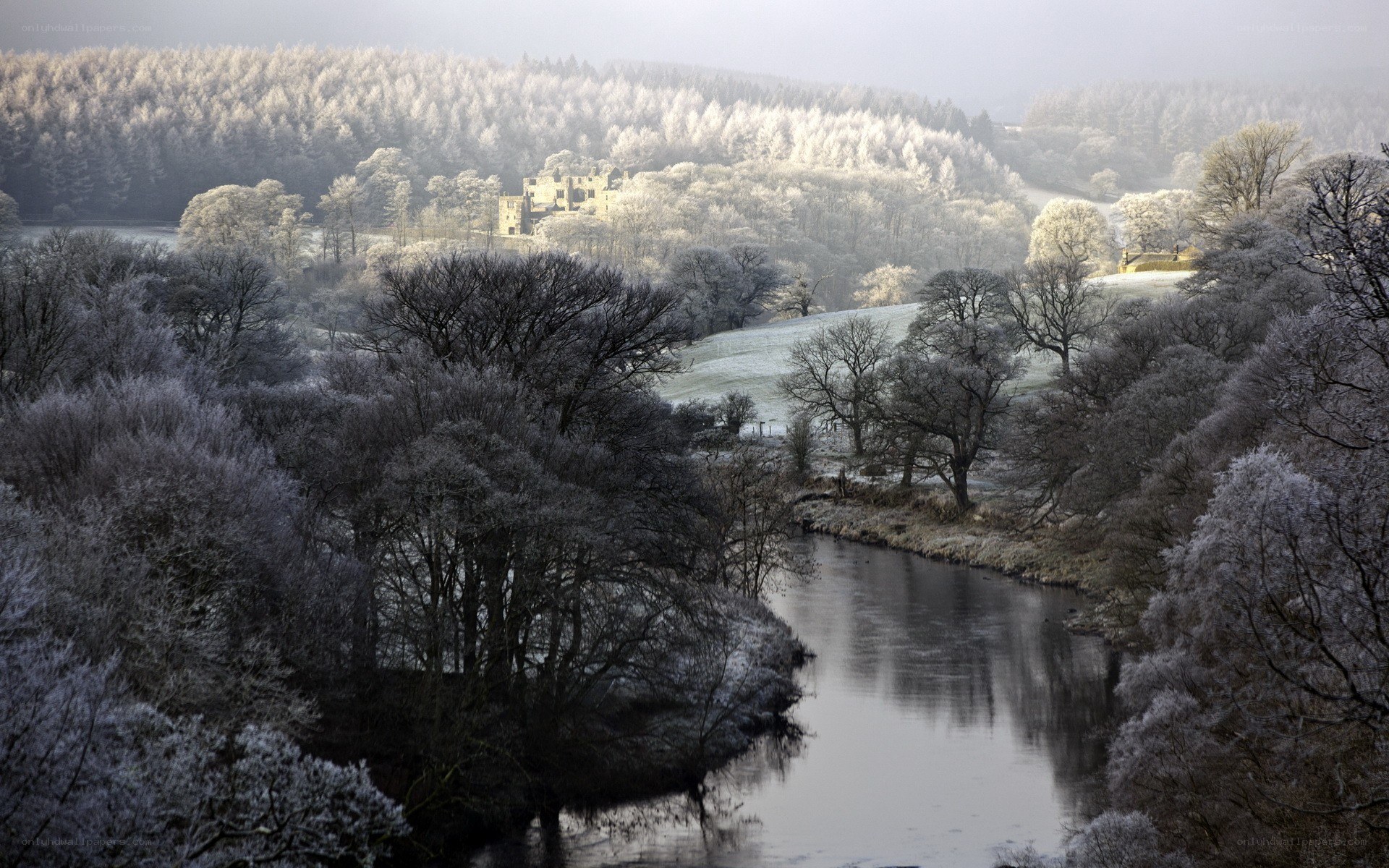 Frosty river landscape with castle