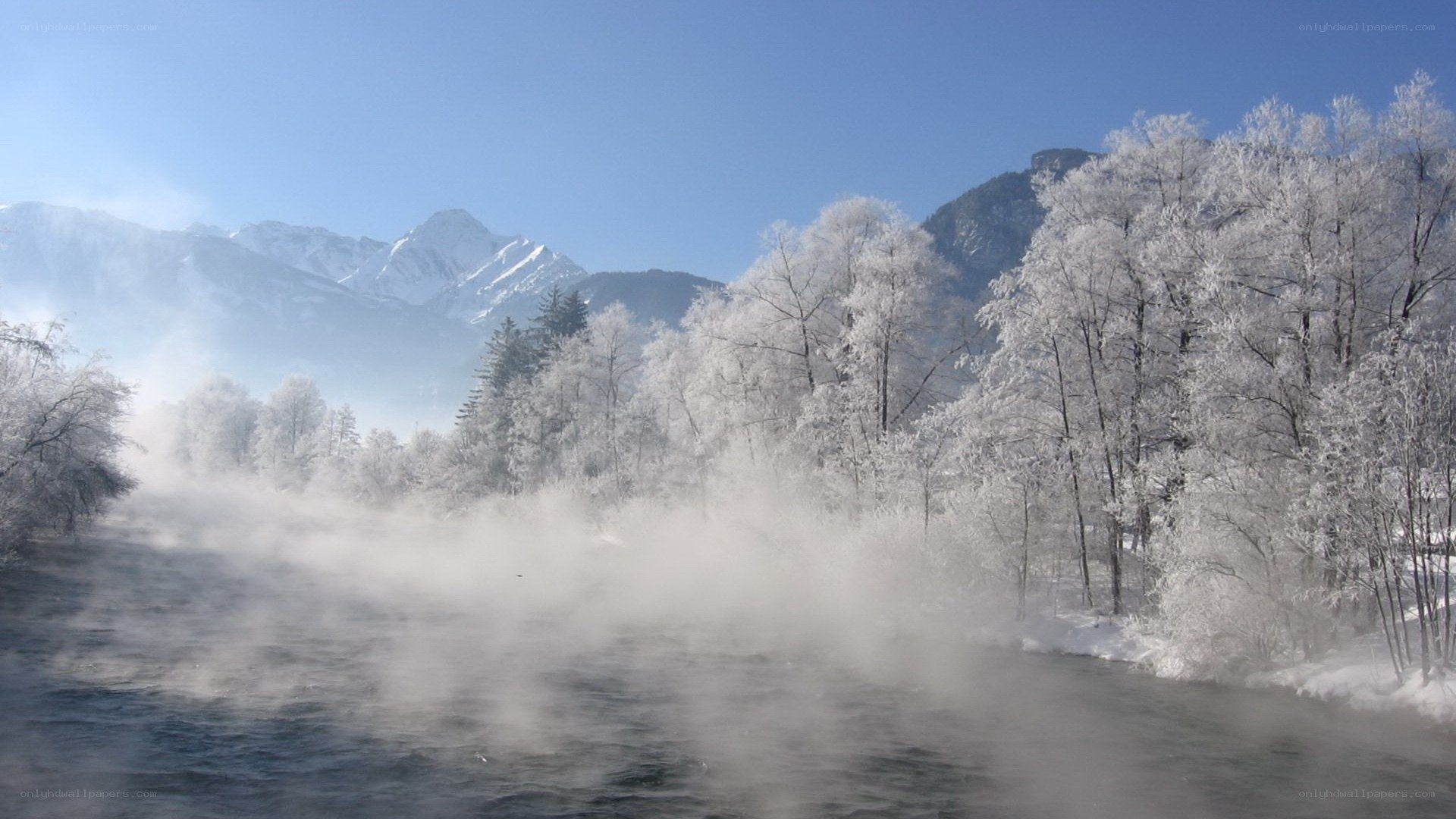 Frosty river with steam and mountains