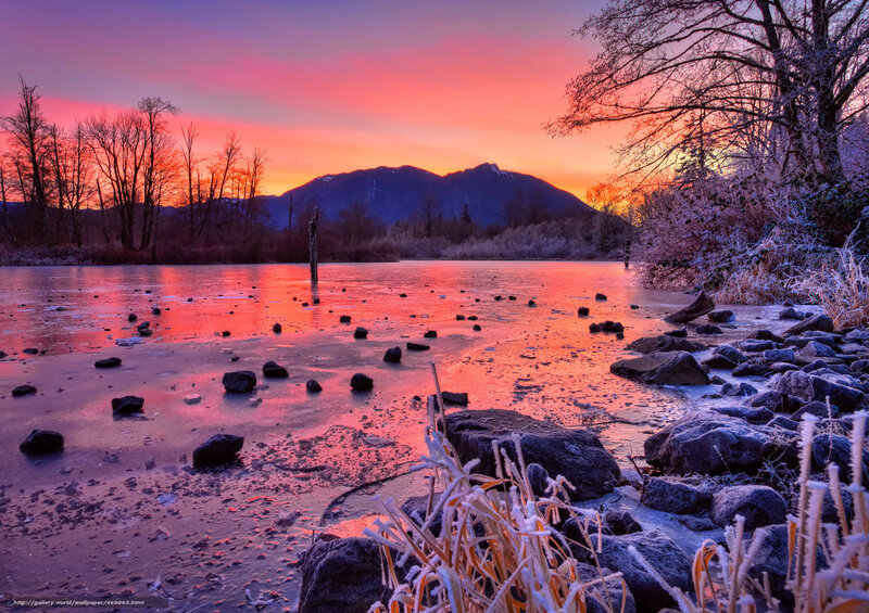 Frosty sunset over frozen lake