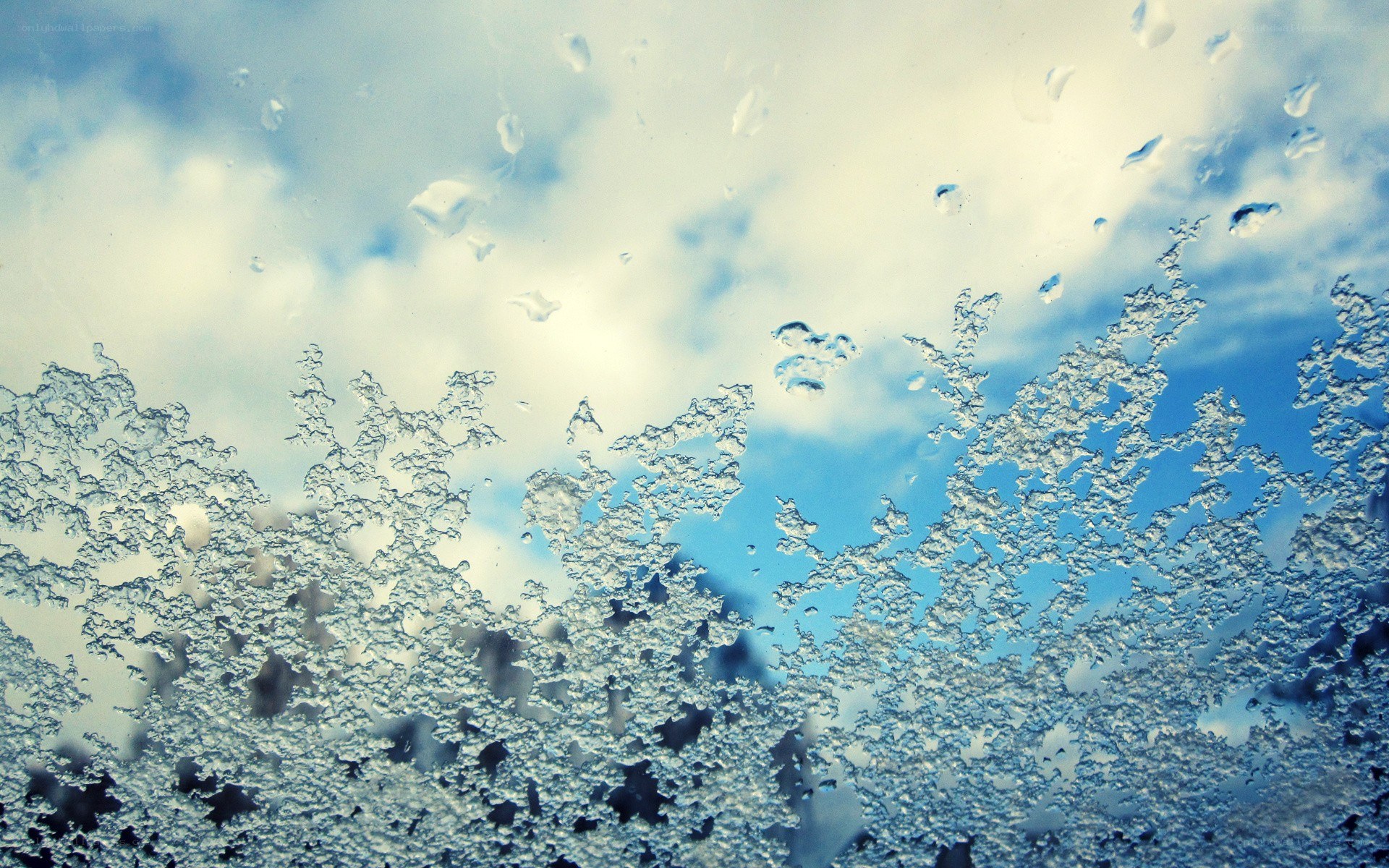 frosty window with sky view