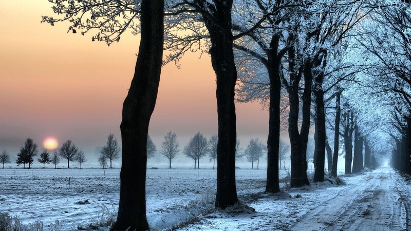 frosty winter road at sunrise