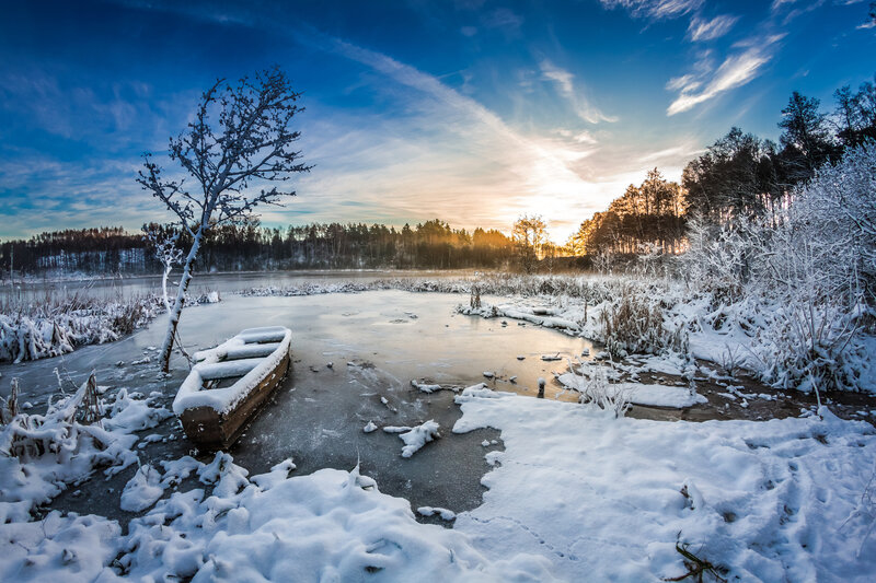 Frozen Boat on Lake