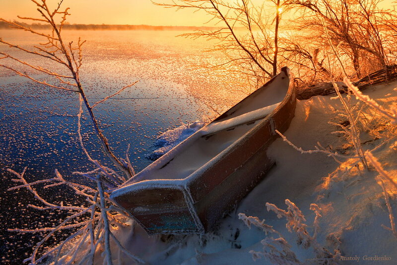 Frozen Boat on Riverbank