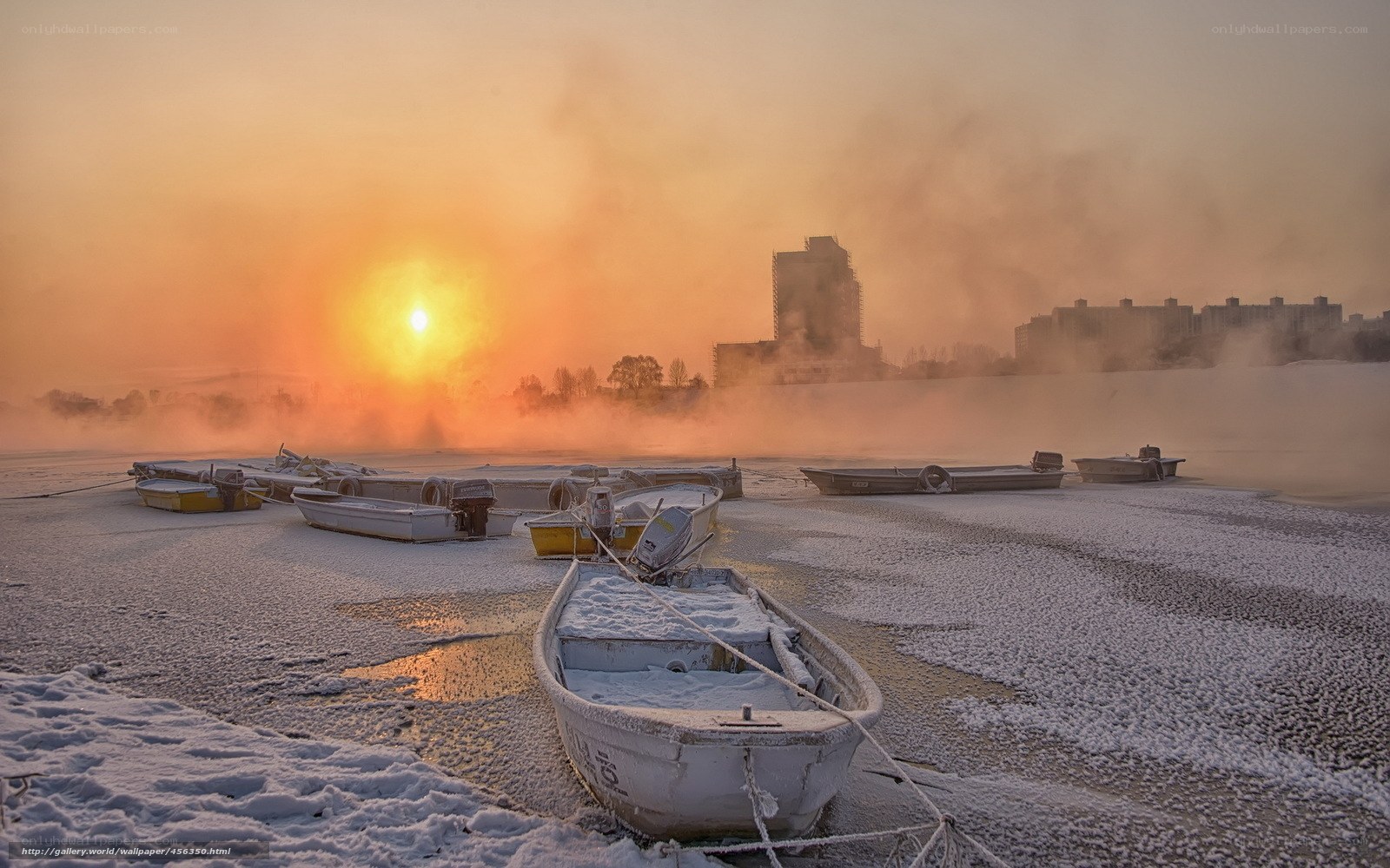 Frozen boats at sunrise
