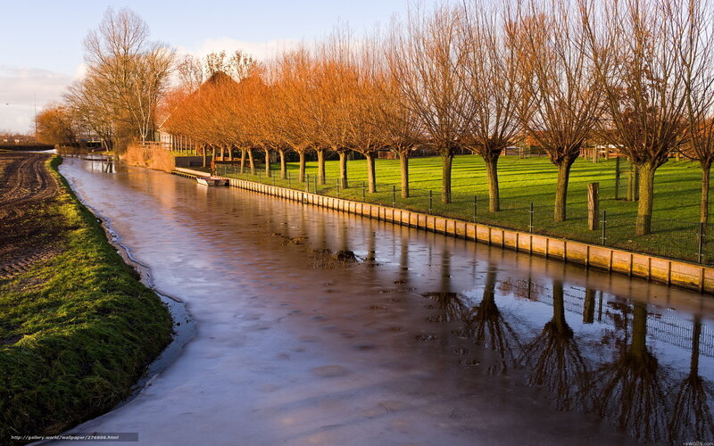 Frozen canal at sunset