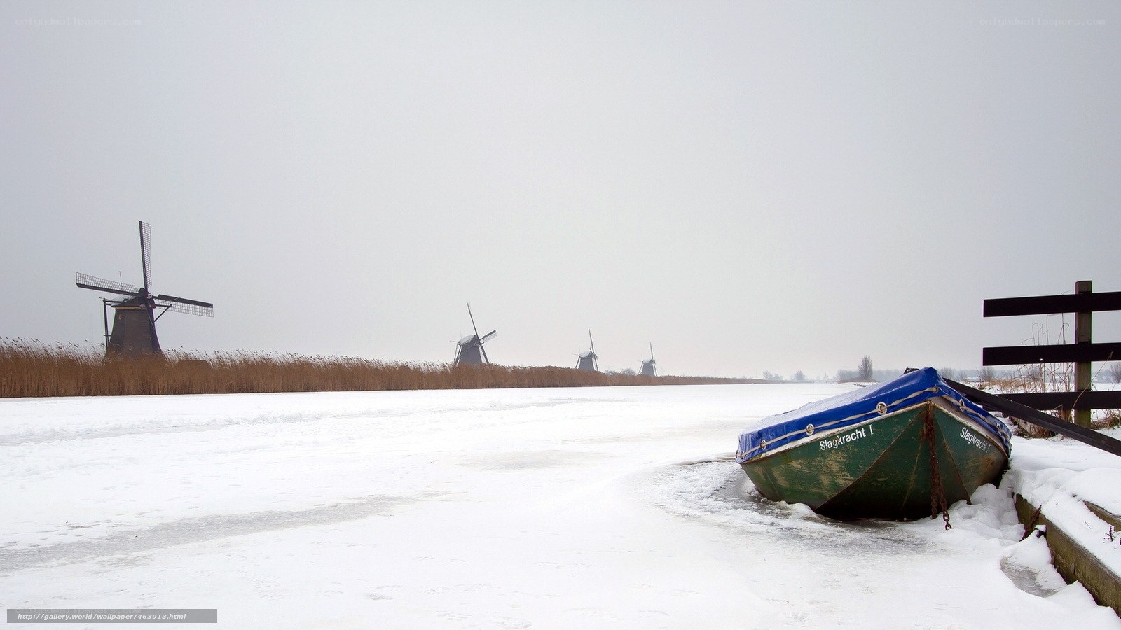 Frozen canal with windmills