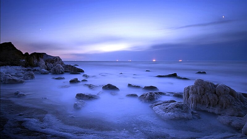 Frozen coastal landscape at dusk