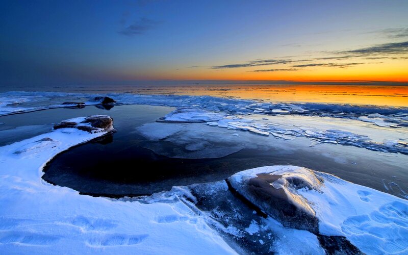 Frozen Coastline at Sunset — Blue