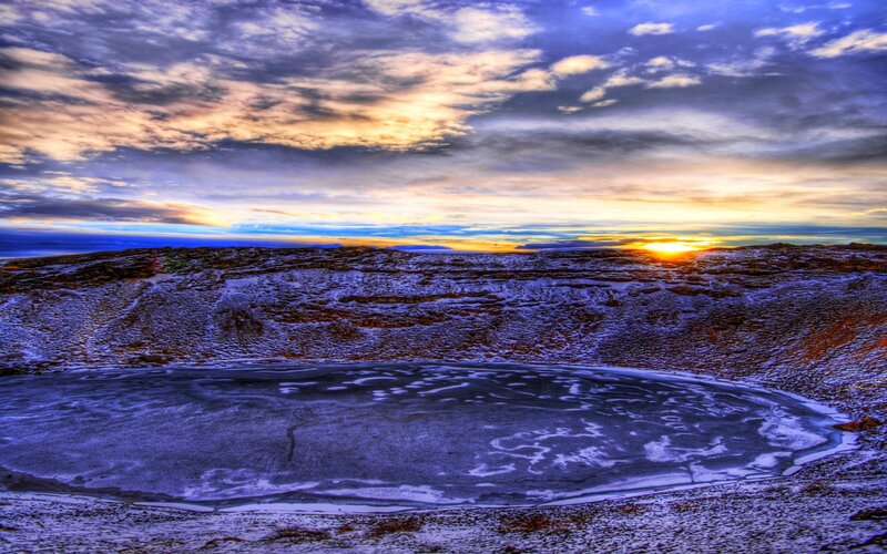 Frozen crater at sunset