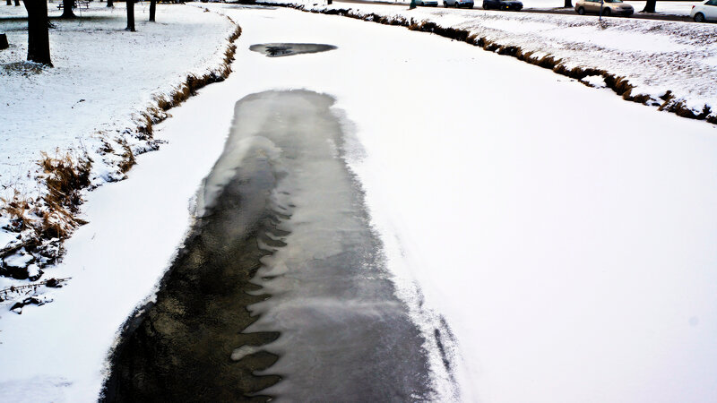 Frozen Creek in Snow