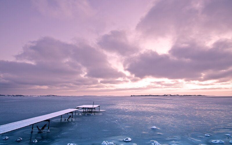 Frozen dock at sunset