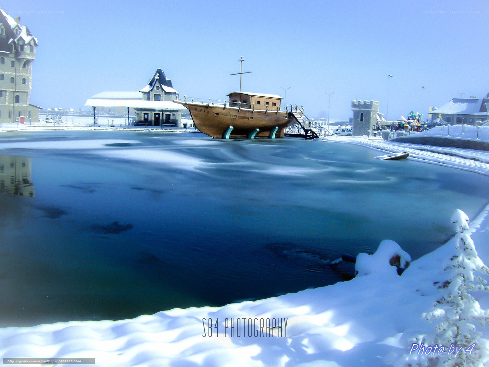 Frozen harbor with ship sculpture