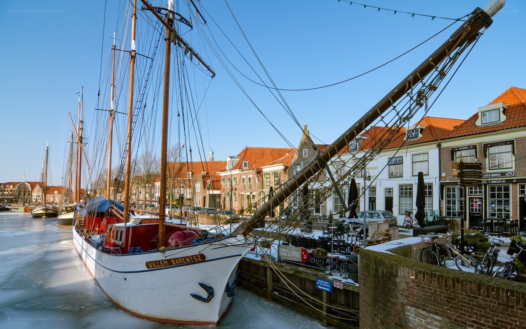 Frozen harbor with tall ship