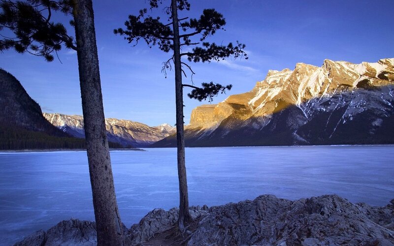 Frozen Lake and Mountains — Blue, Serene, Winter, Photograph, Trees, Rocks, Snow