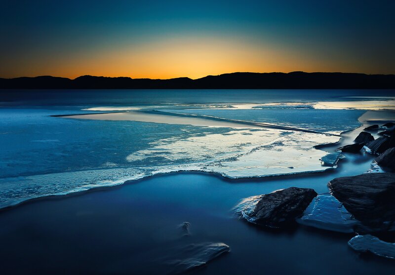 Frozen Lake at Dusk — Blue, Serene, Sunset, Photograph, Ice, Rocks