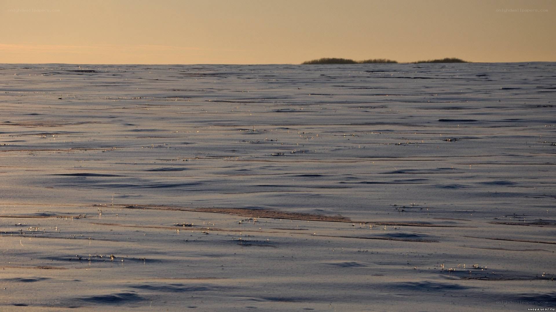 Frozen lake at sunset