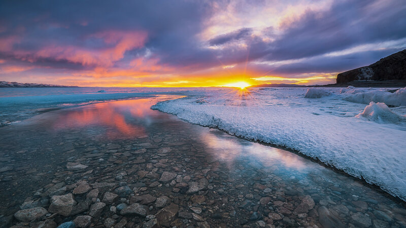 Frozen Lake at Sunset — Orange, Dramatic, Photograph, Sun, Ice, Rocks, Clouds