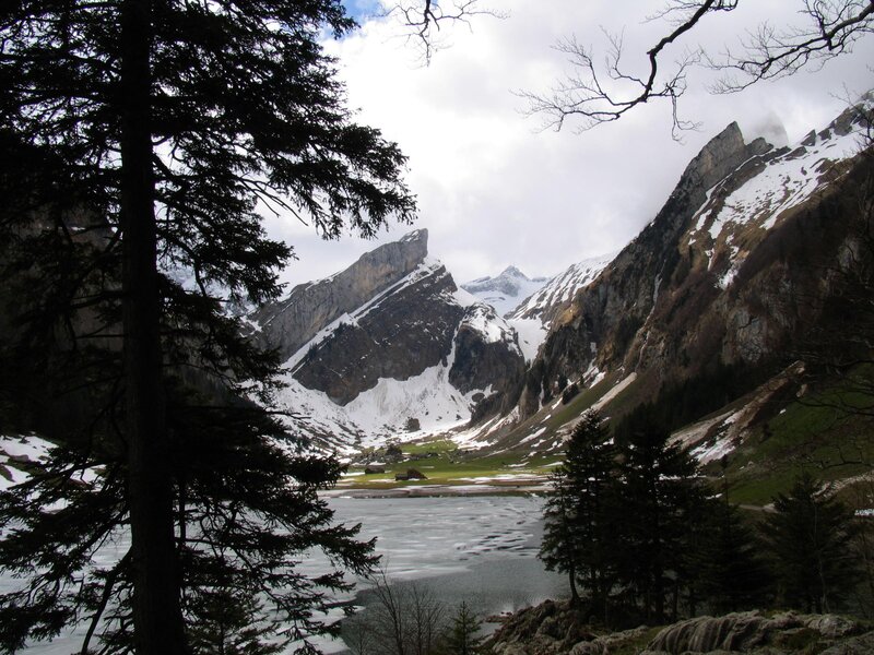 frozen lake in alpine valley