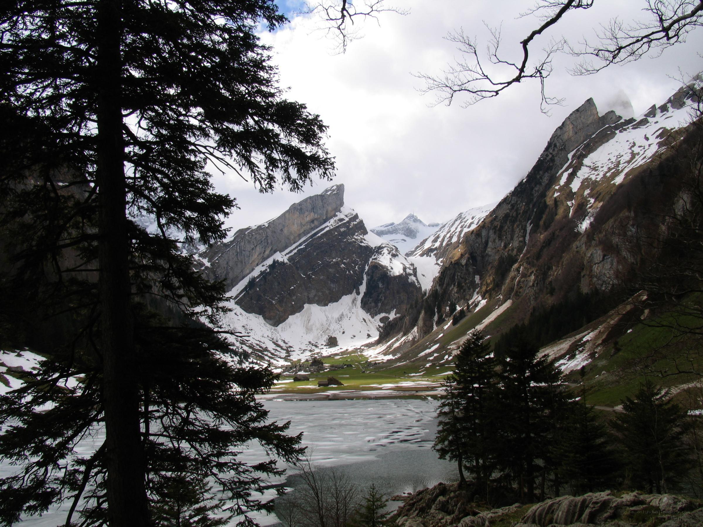 frozen lake in alpine valley