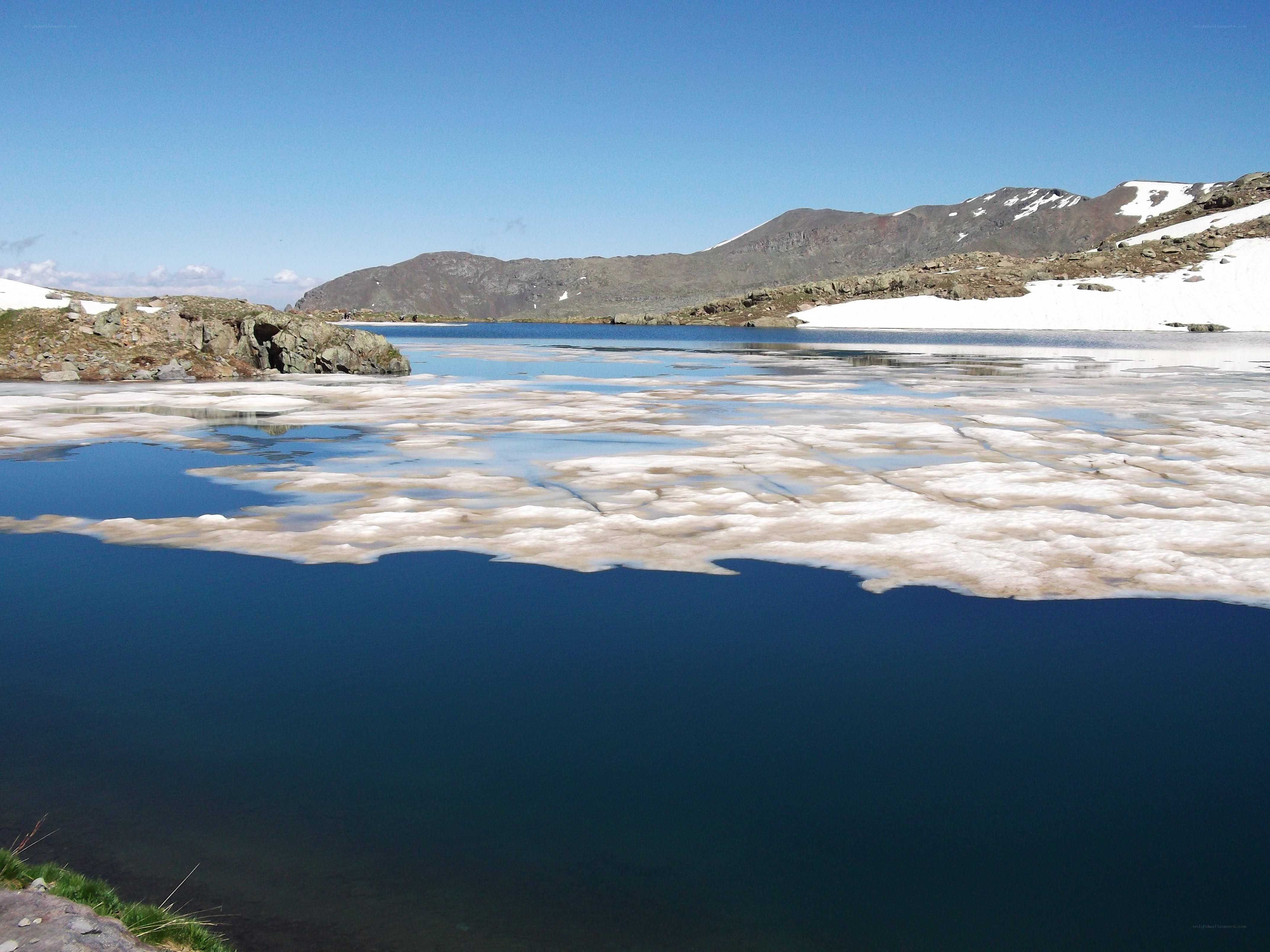 Frozen lake in mountain landscape