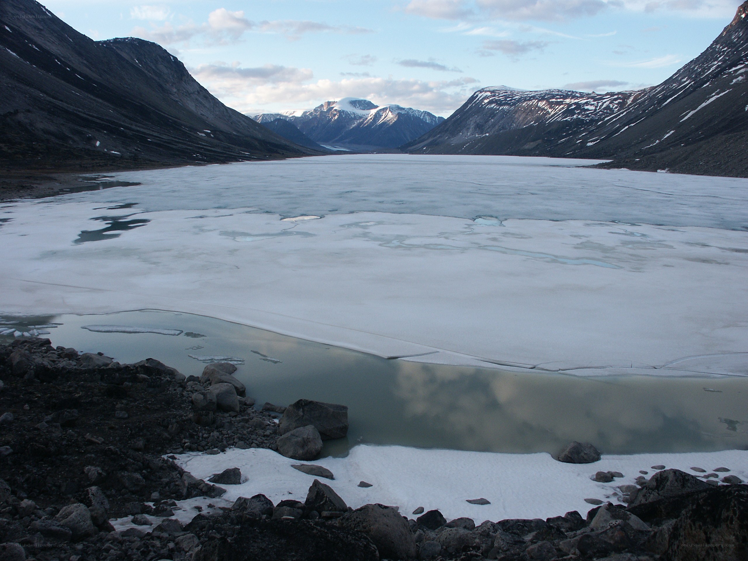 Frozen lake in mountain valley