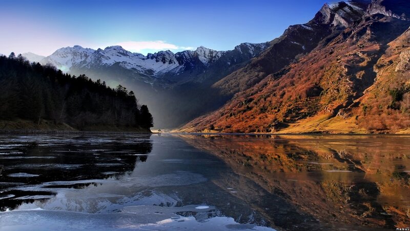 frozen lake in mountain valley