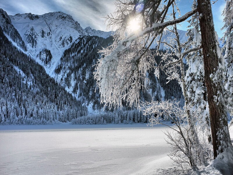 Frozen Lake in Mountains — White, Serene, Winter, Photograph, Snow-covered Trees