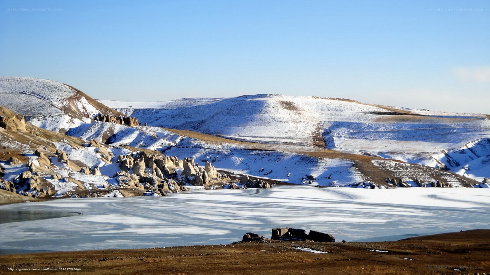 Frozen lake in snowy landscape