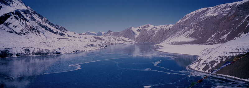 frozen lake in snowy mountains