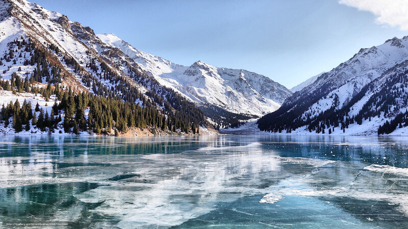 Frozen lake in snowy mountains