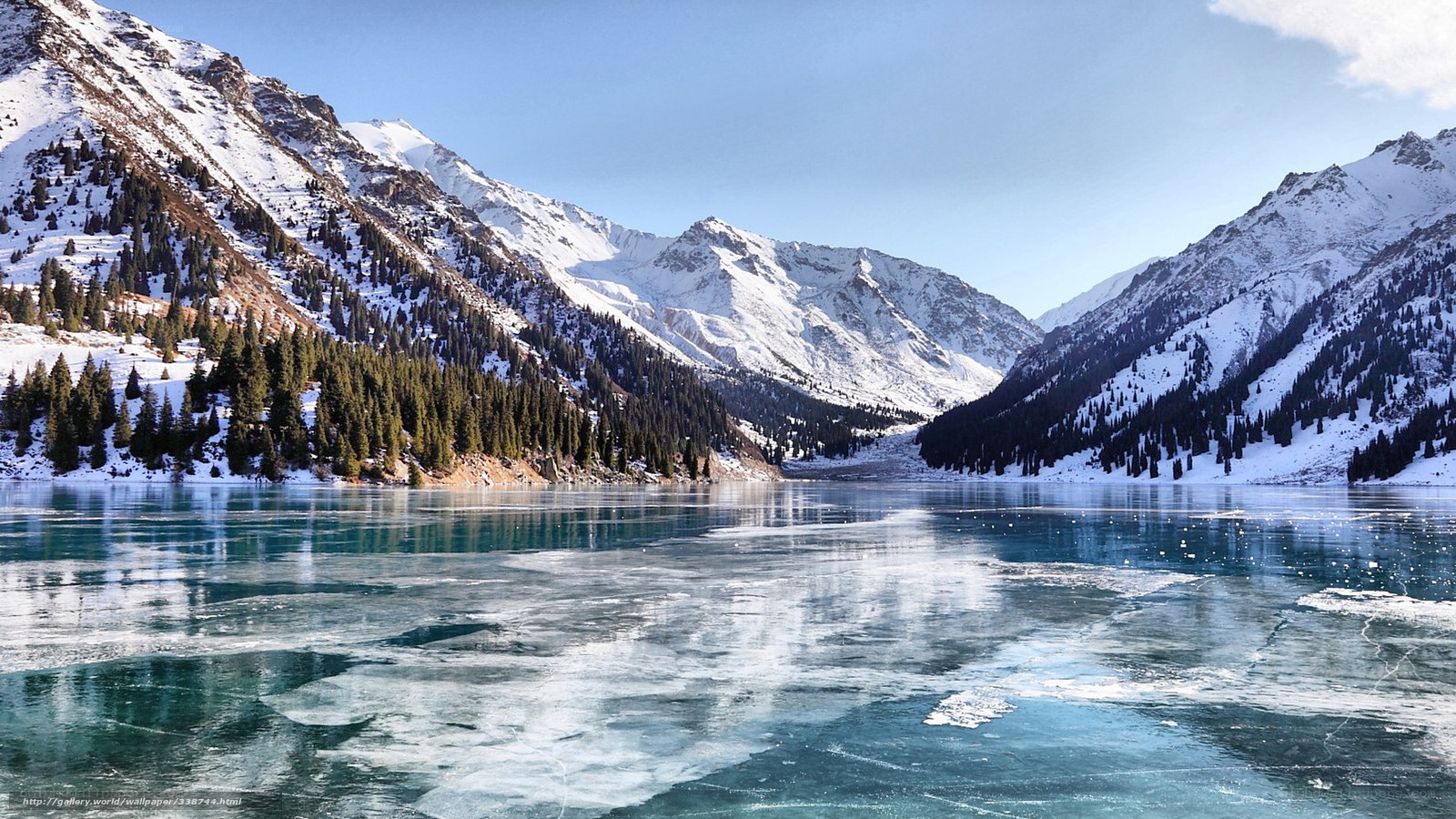 Frozen lake in snowy mountains