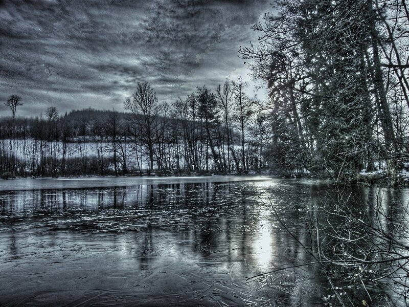 Frozen lake in winter landscape