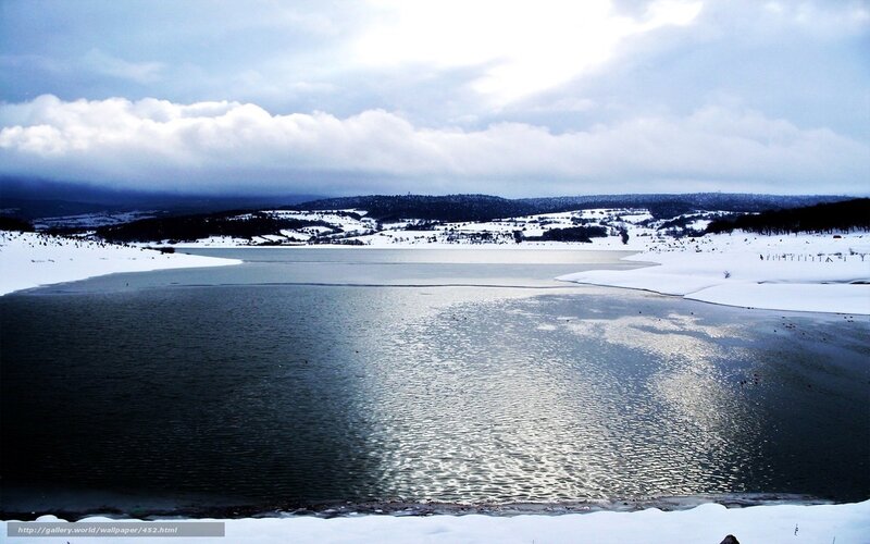 Frozen lake in winter landscape