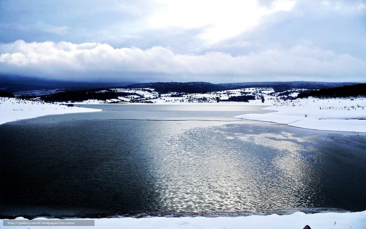 Frozen lake in winter landscape